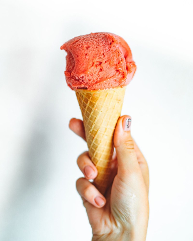 An ice cream cone with a single scoop.